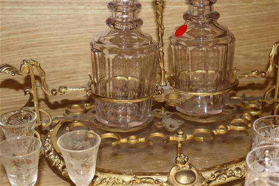 An ormolu and glass liqueur stand and a plated toddy stand